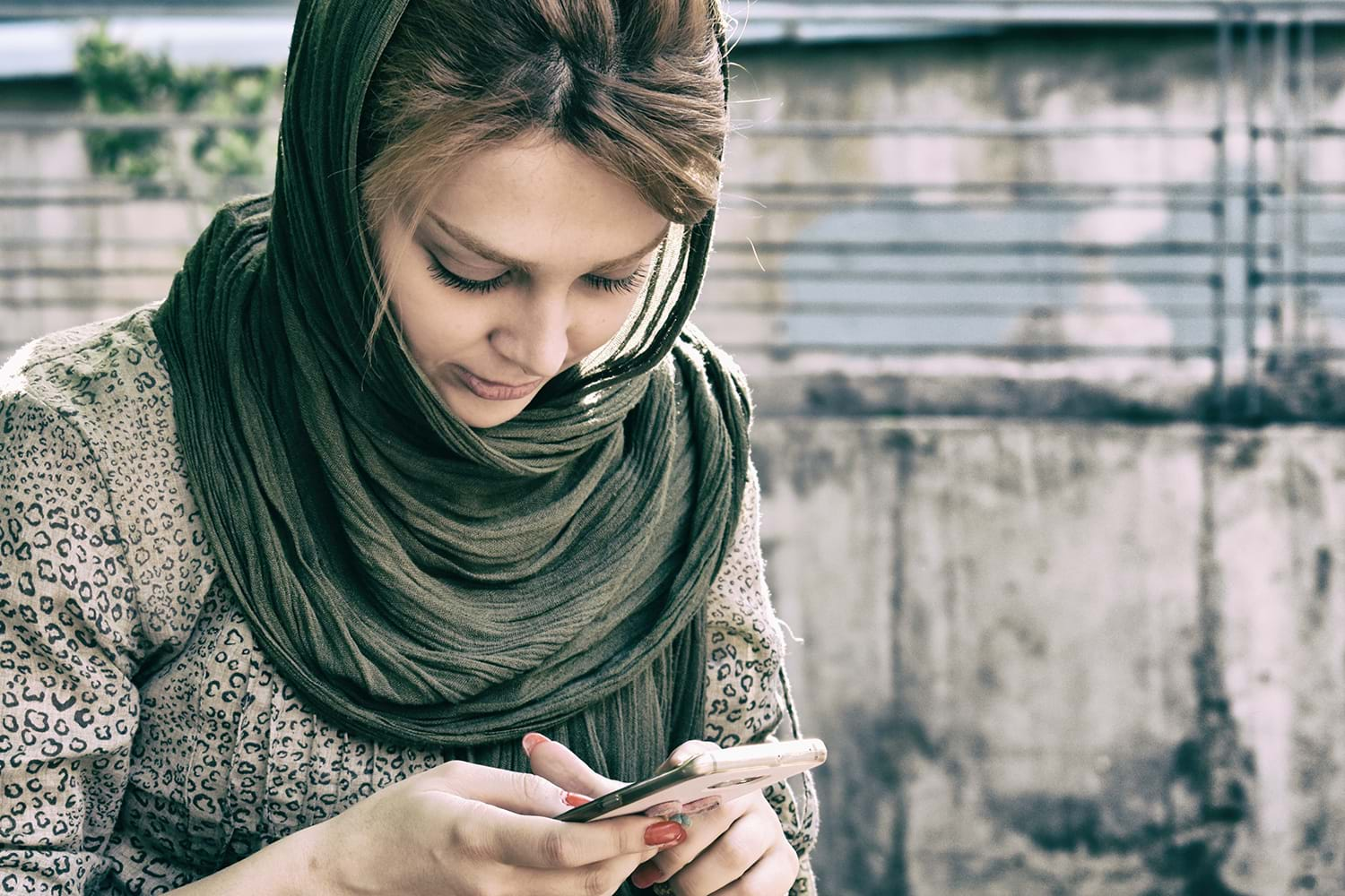 Woman looking down at her phone