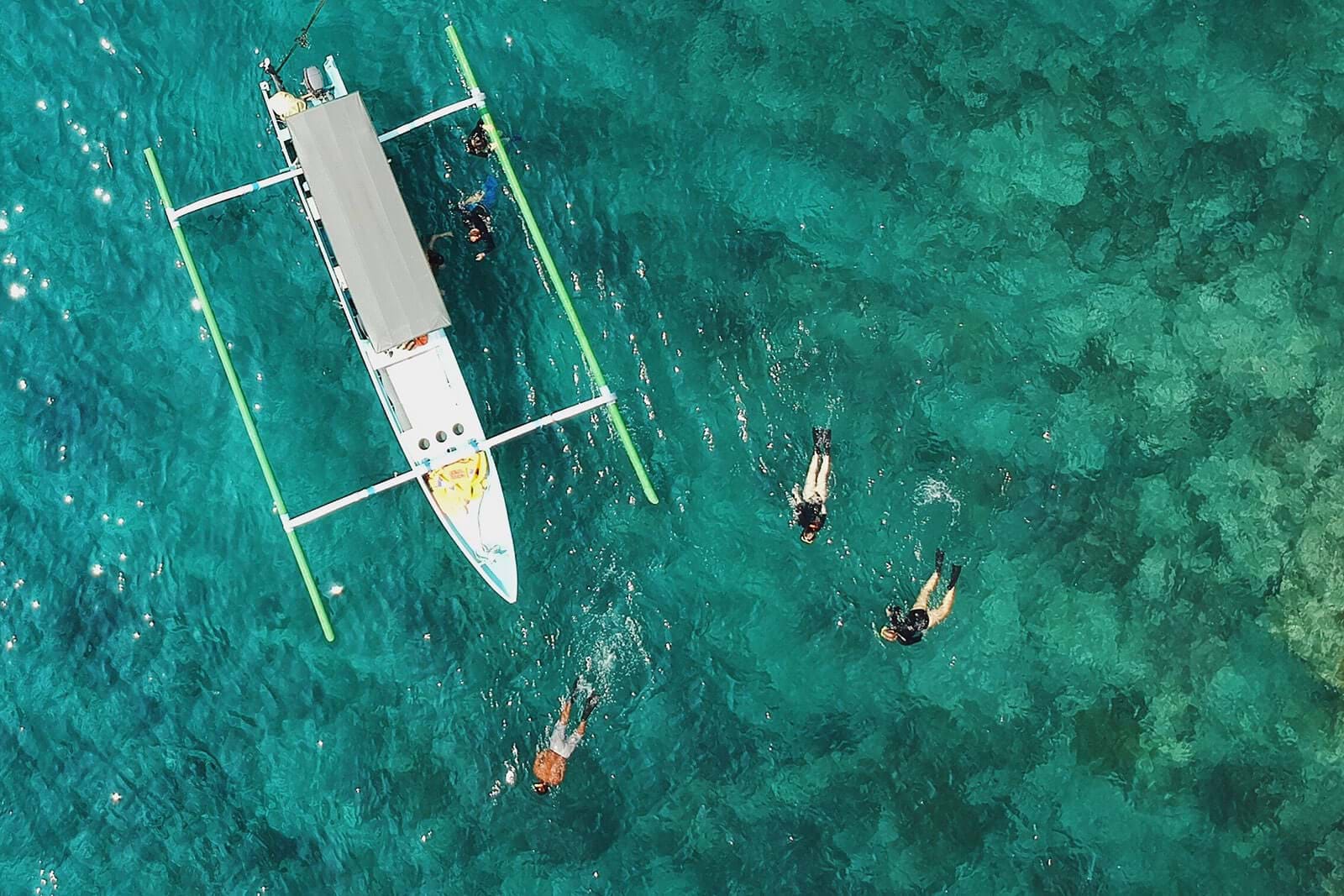 Aerial view of snorklers and boat