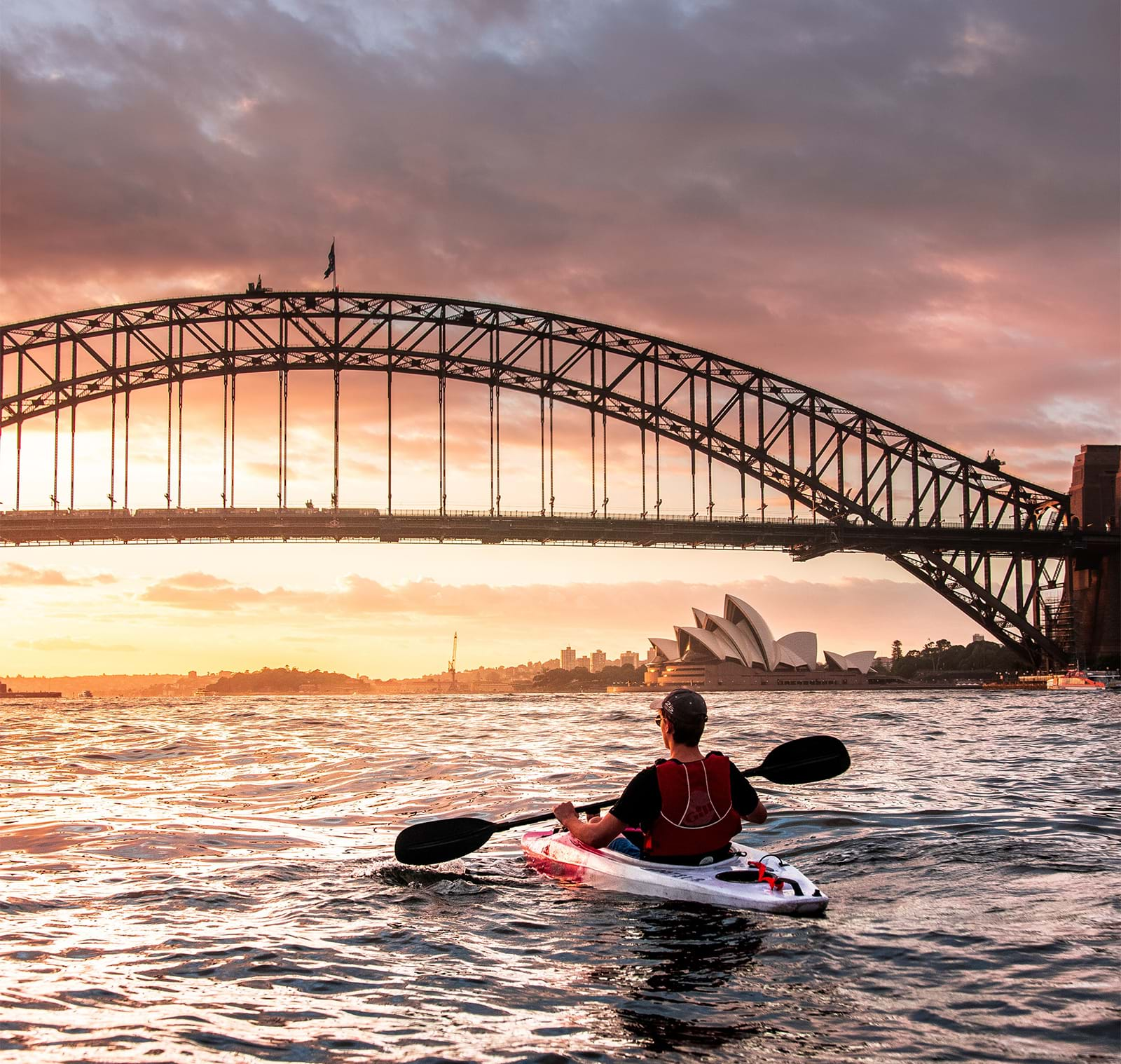 Man kayaking in Sydney harbor