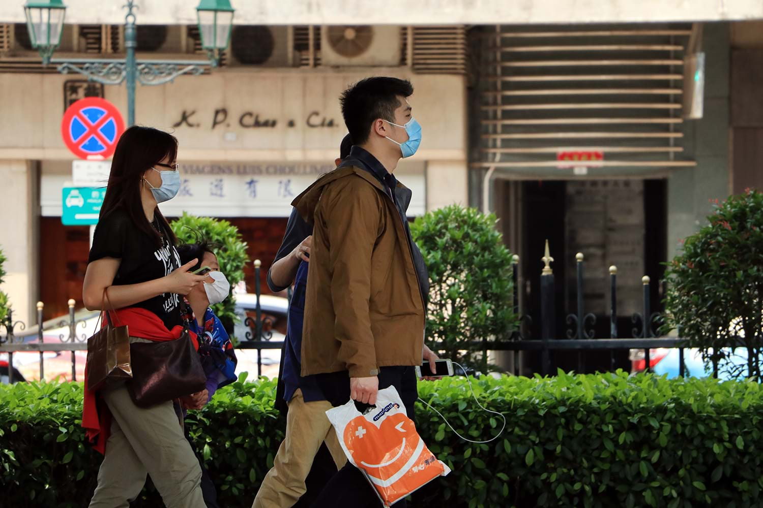 Family walking through city shopping