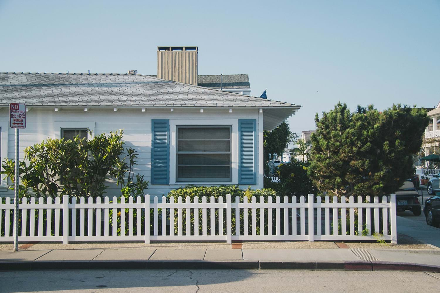 Small house with white fence