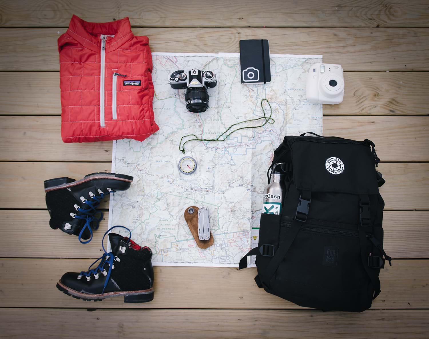 Map of national park, backpack, and other hiking essentials