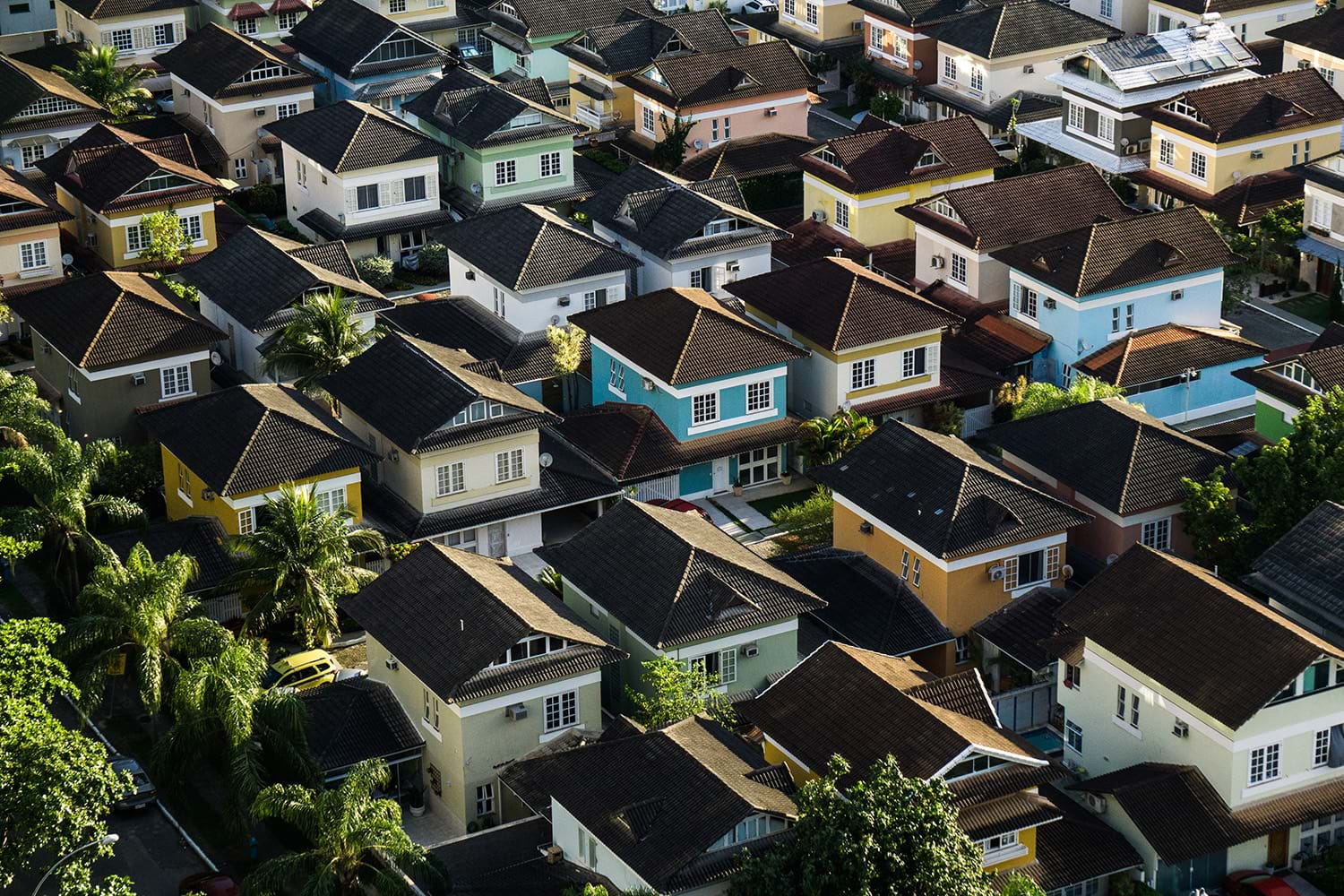 Cluster of similar houses of different colors