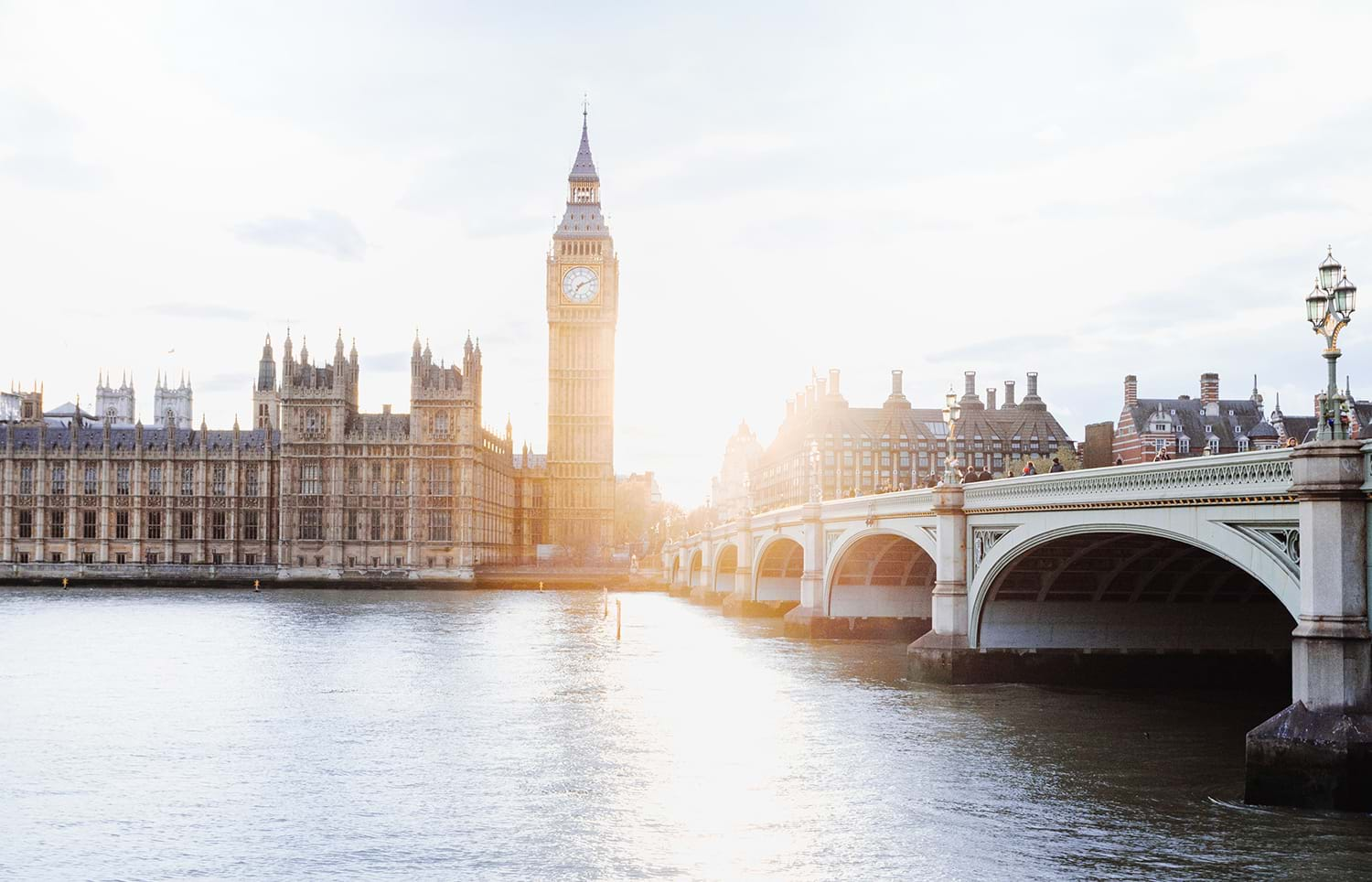 View of River Thames with sunlight shining past Big Ben