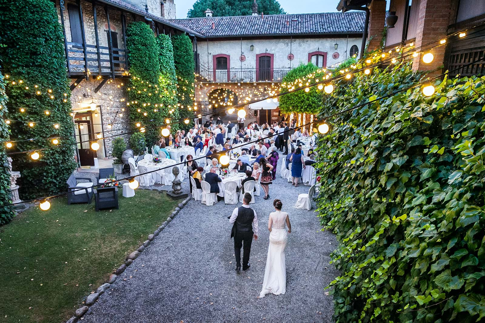 Outdoor wedding reception in courtyard