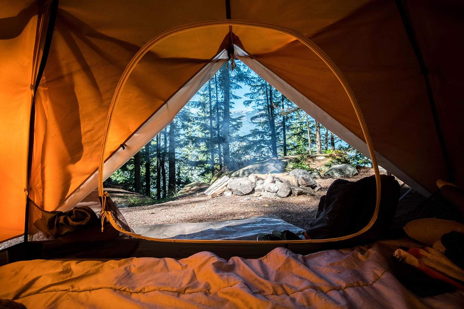 Inside orange tent in woods