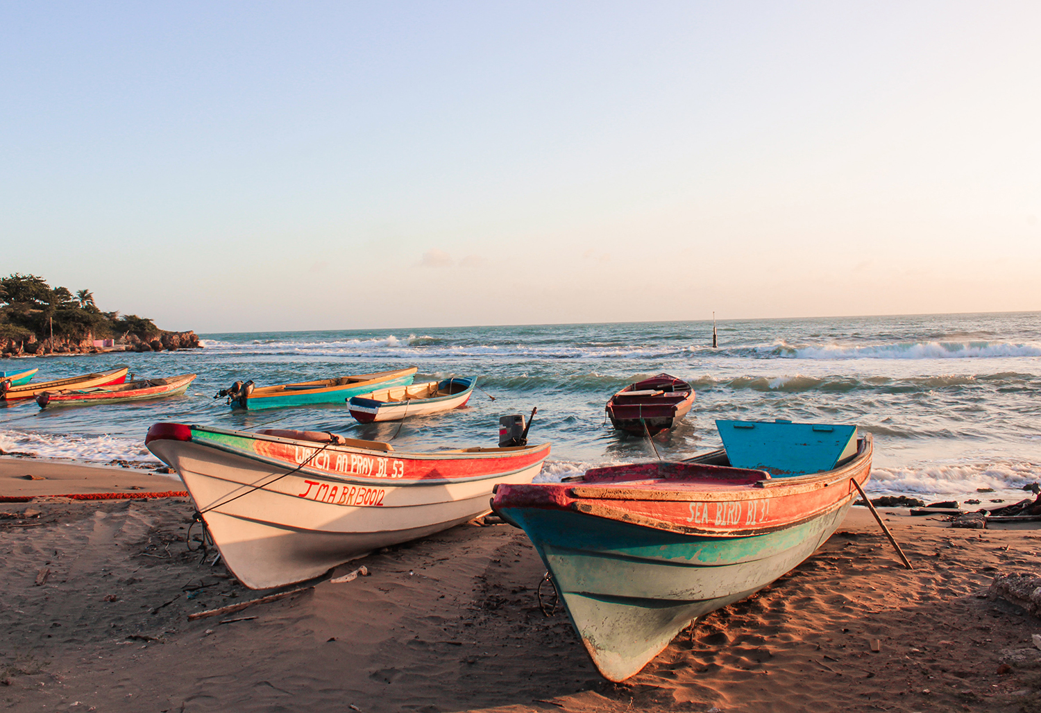 Small boats on ocean beach