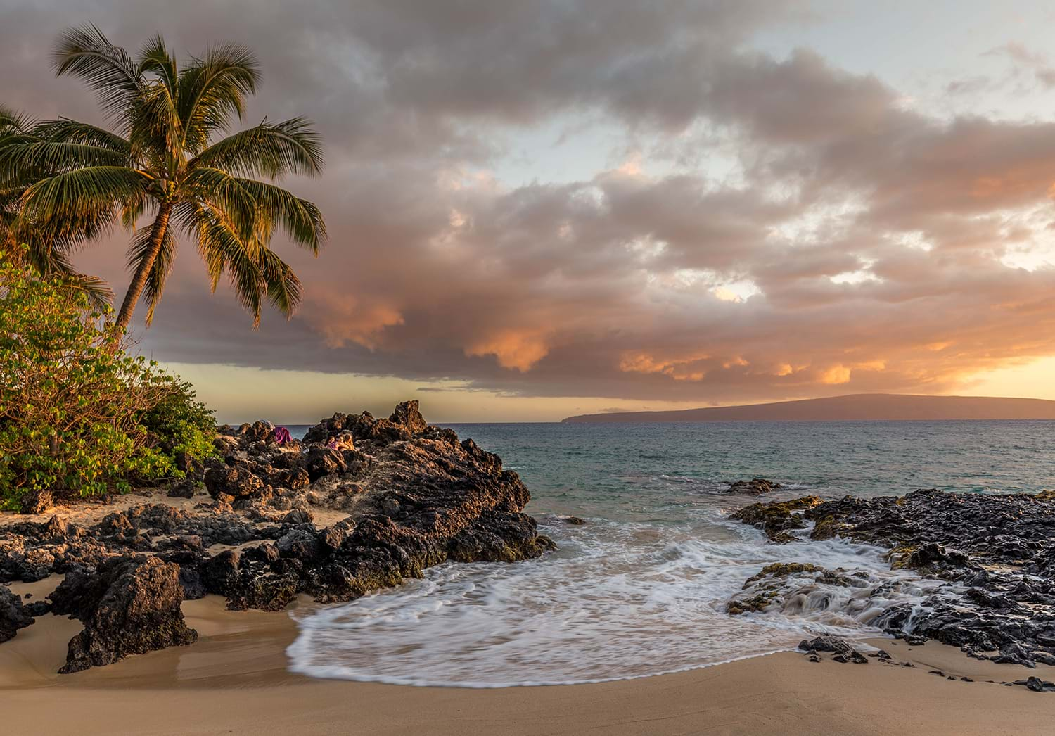 Rocky island beach at sunset