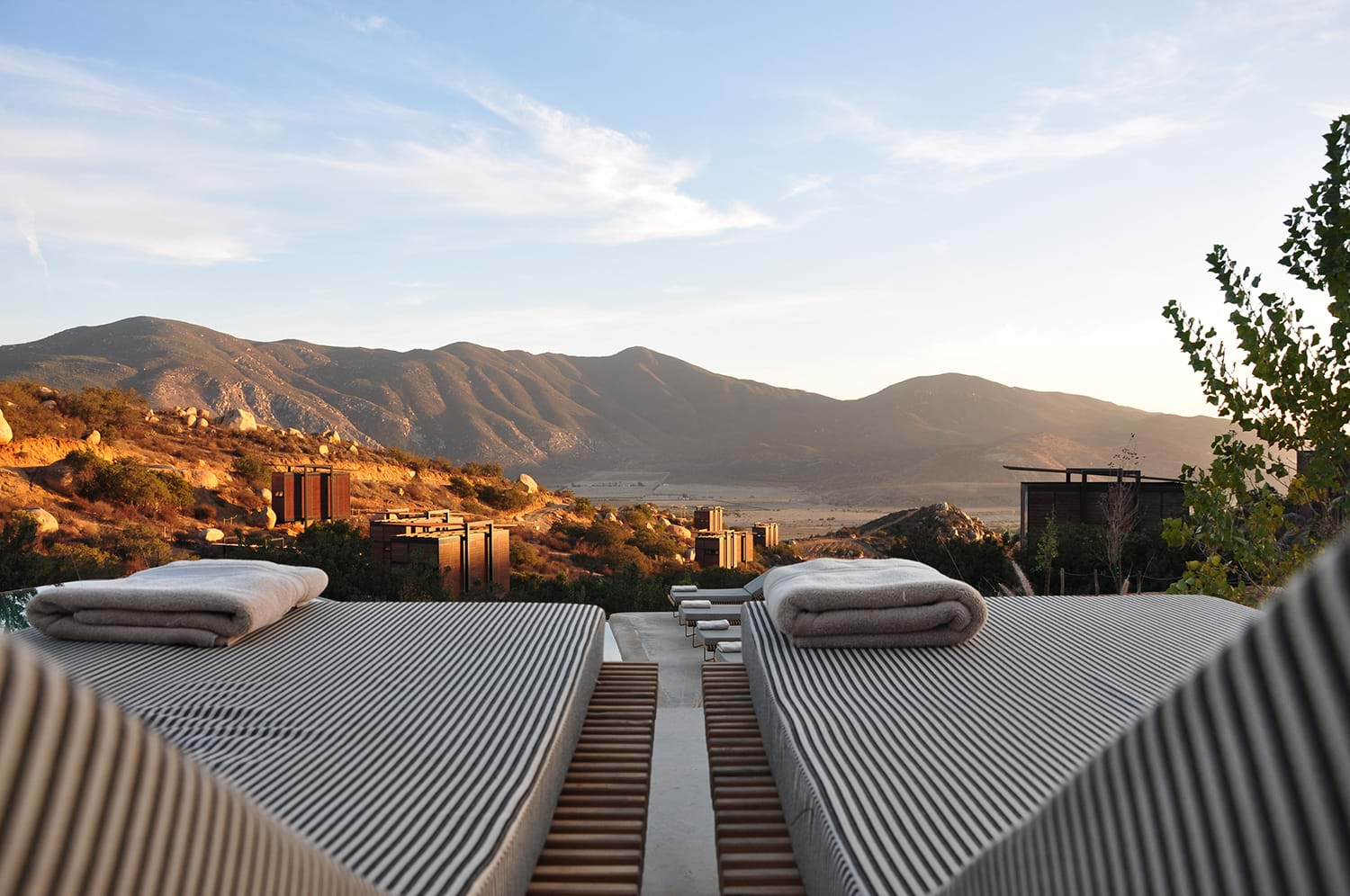 Two pool chairs overlooking view