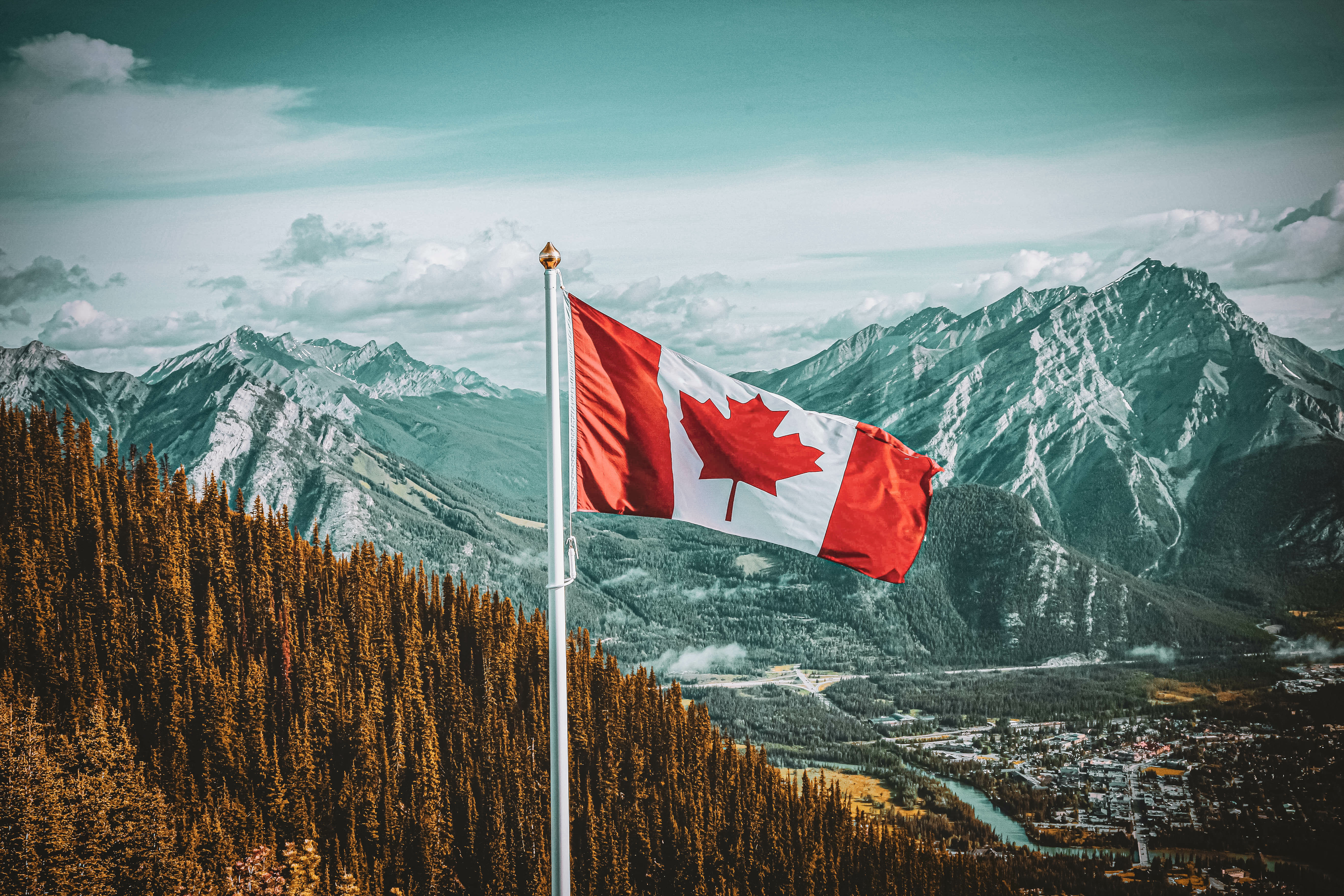 Canadian flag over landscape