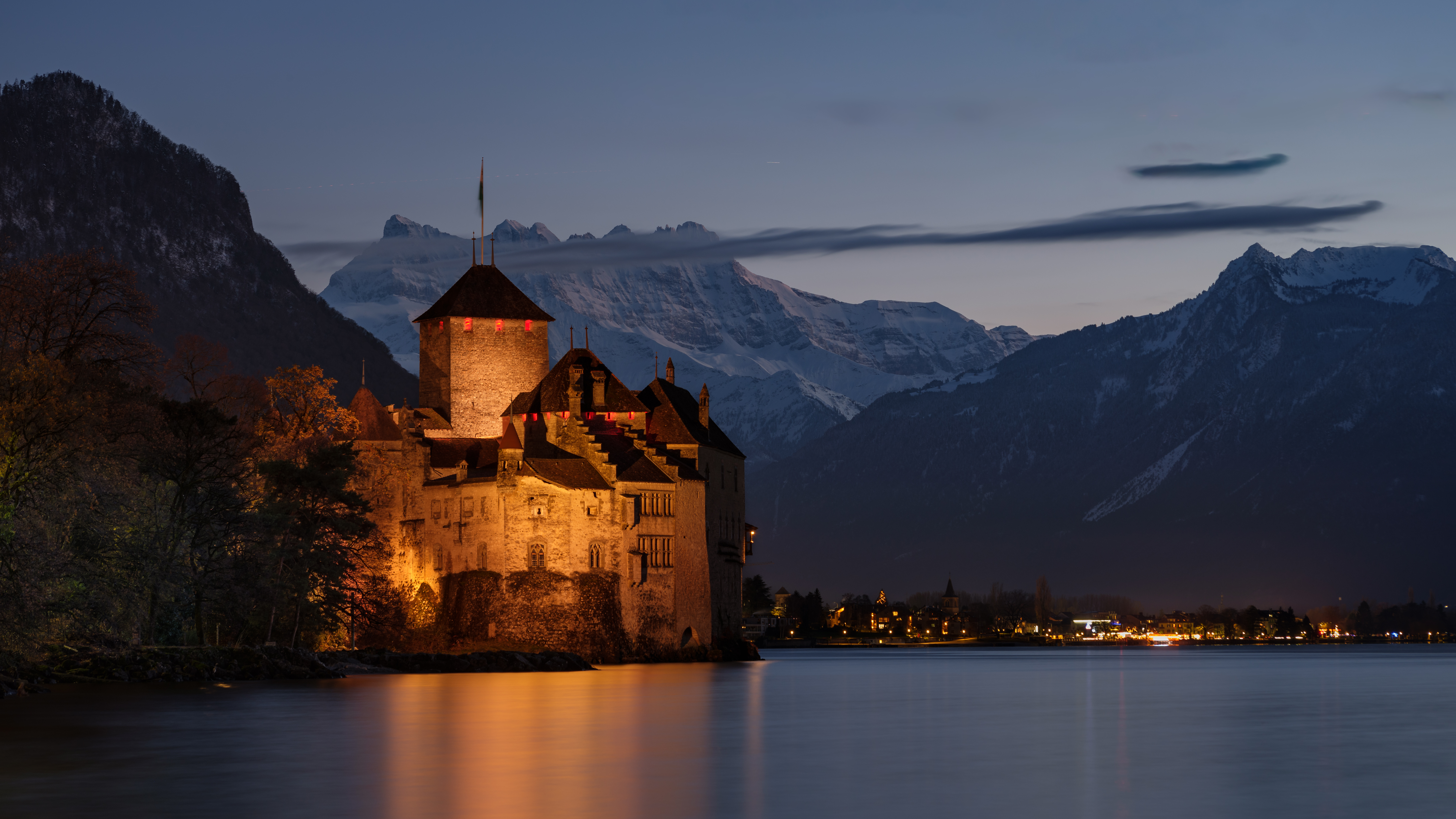 castle by lake at night