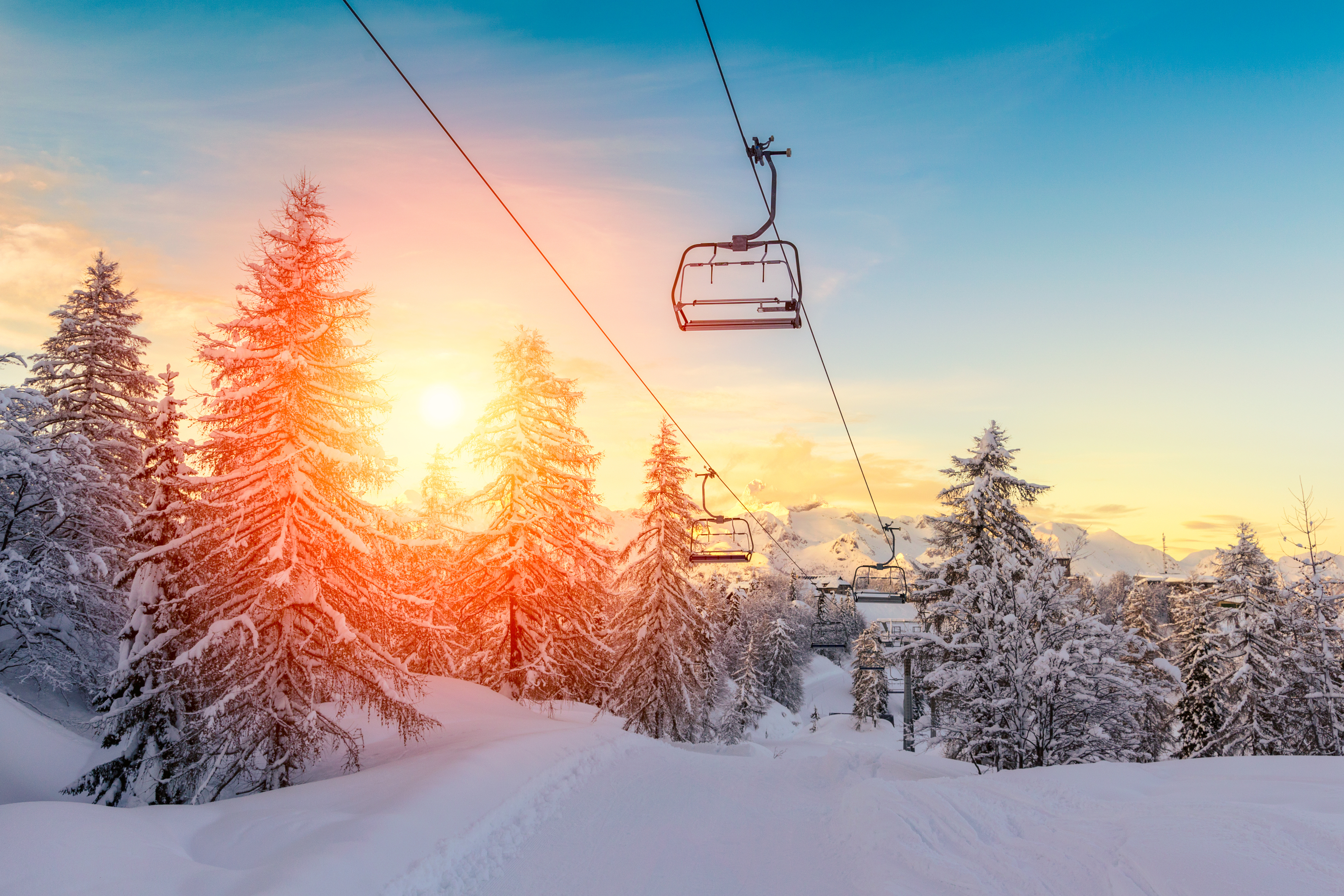 sunset winter landscape with ski lift