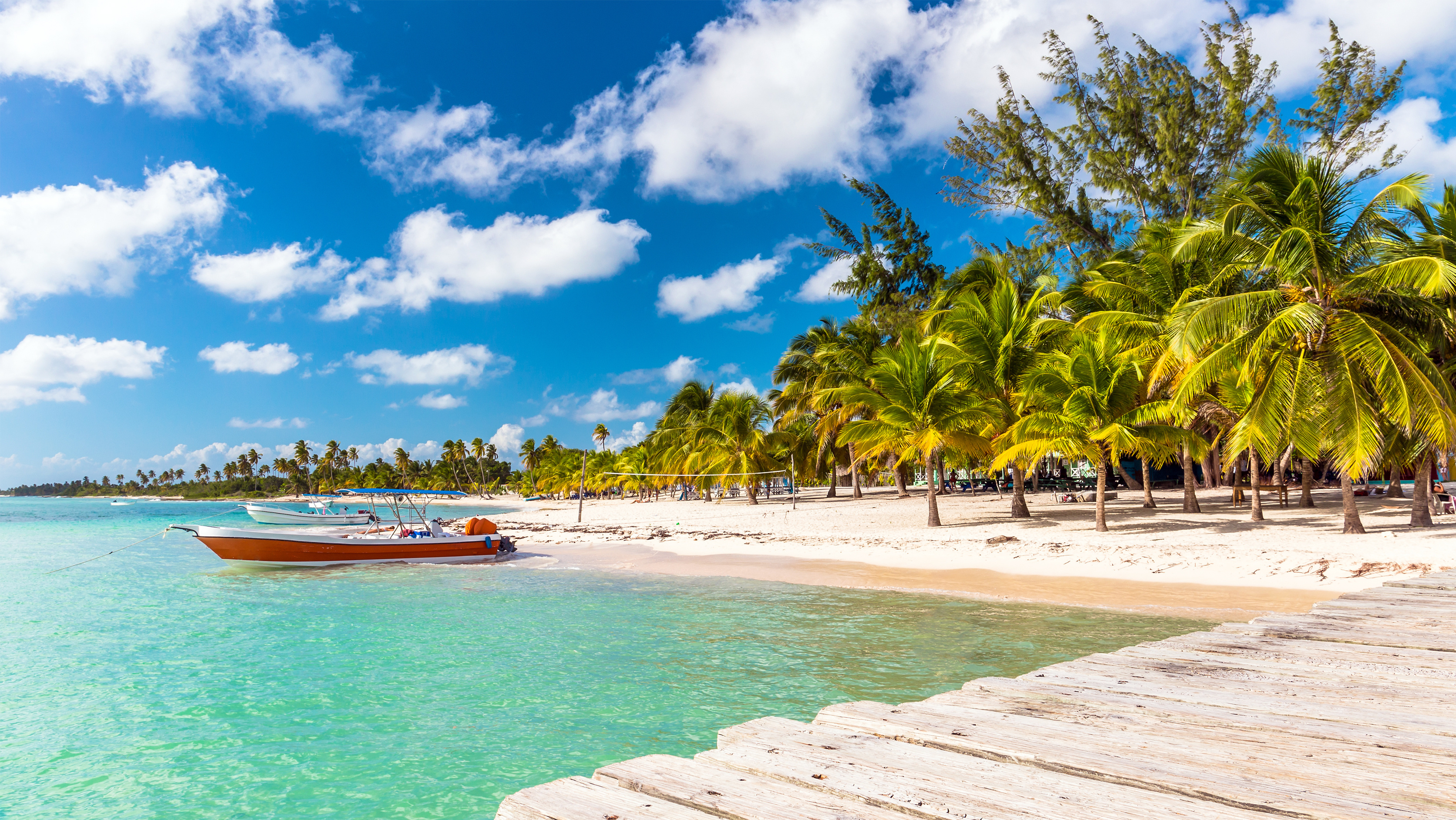 boats anchored at beach in Punta Cana