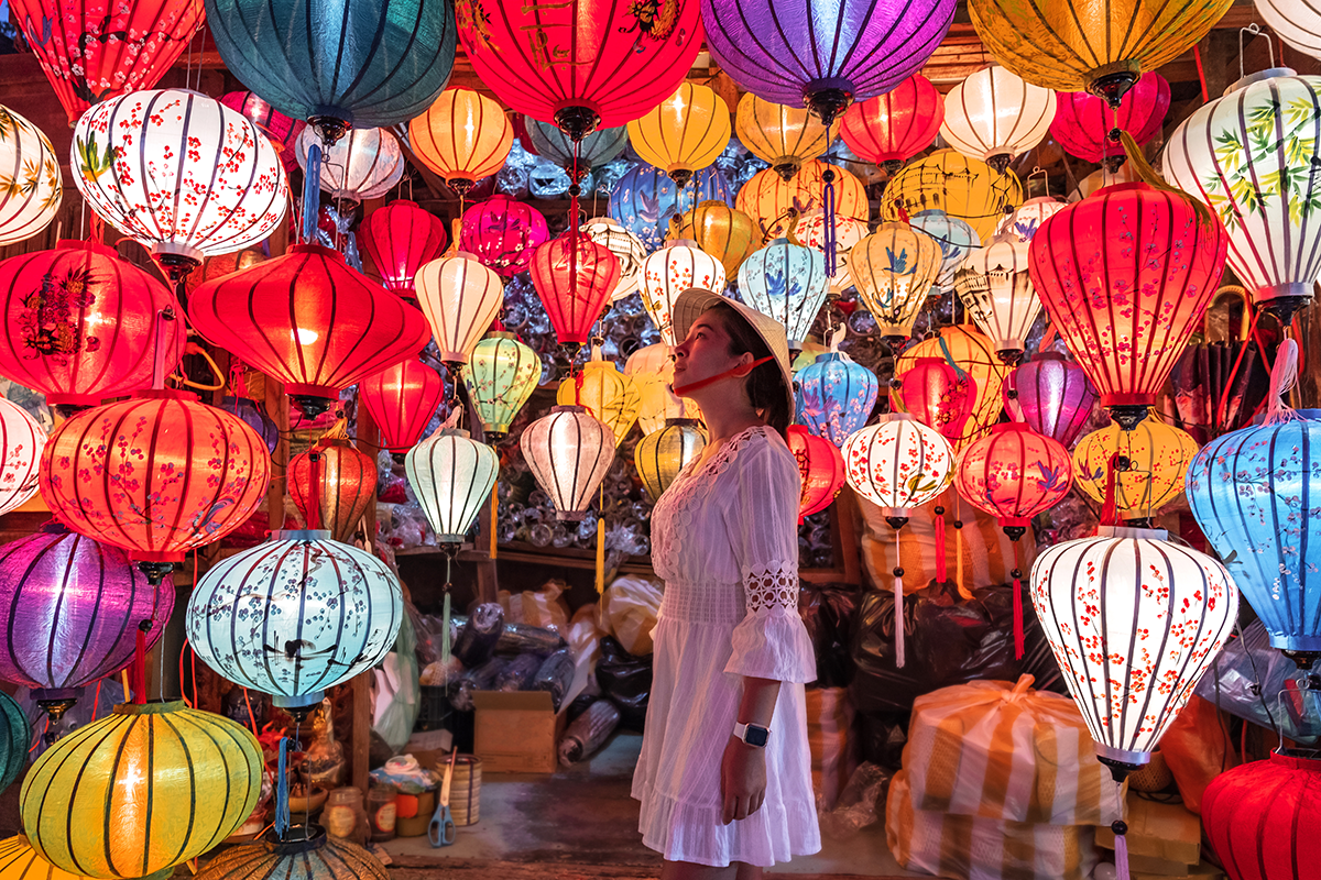 woman looking at lanterns