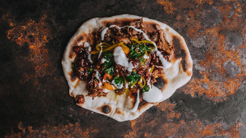 Tender and aromatic with a satisfying depth of flavour, this Smoked Beef Naan — provided by Tom Griffith of Flank fame — is so worth the effort.