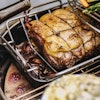 Rectangular drip pan with roasted sirloin of beef and red wine gravy