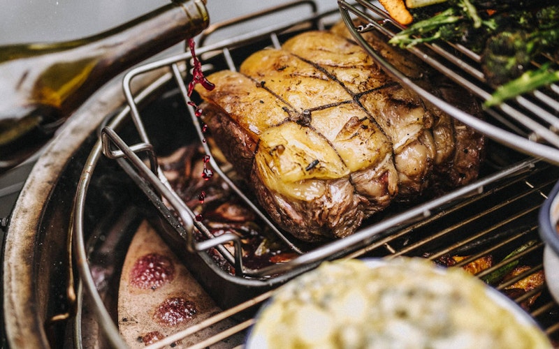 Rectangular drip pan with roasted sirloin of beef and red wine gravy