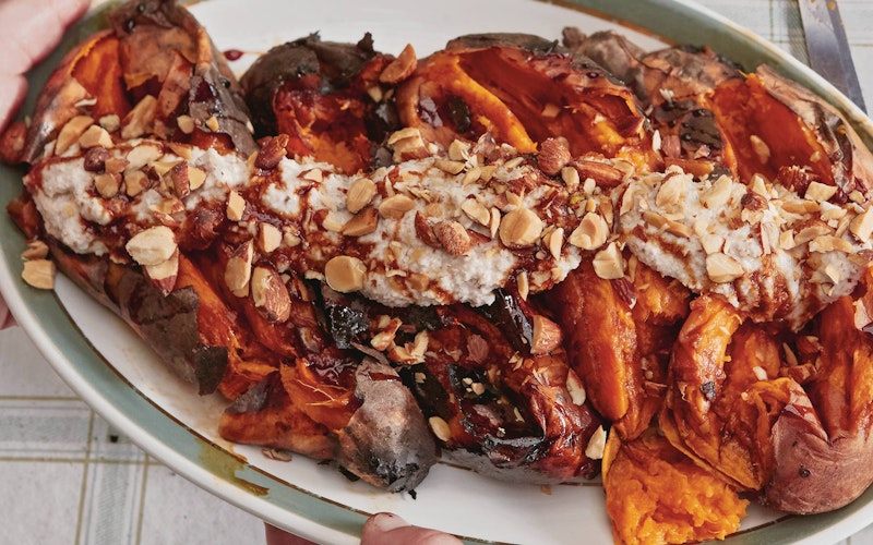 Dirty Sweet potatoes, with almond tahini and smoked almonds | Dirty cooking | Vegetarian Recipes | Honey & Co Chasing smoke cooking over fire around the levant | Big Green Egg