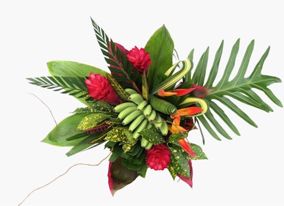 Vibrant tropical bouquet with red flowers, green foliage, and yellow accents on a white background, embodying a fresh and exotic arrangement.