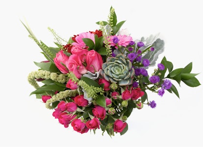 Beautiful bouquet of mixed flowers including pink roses, purple accents, and lush greenery on a white background, perfect as a gift or decoration.