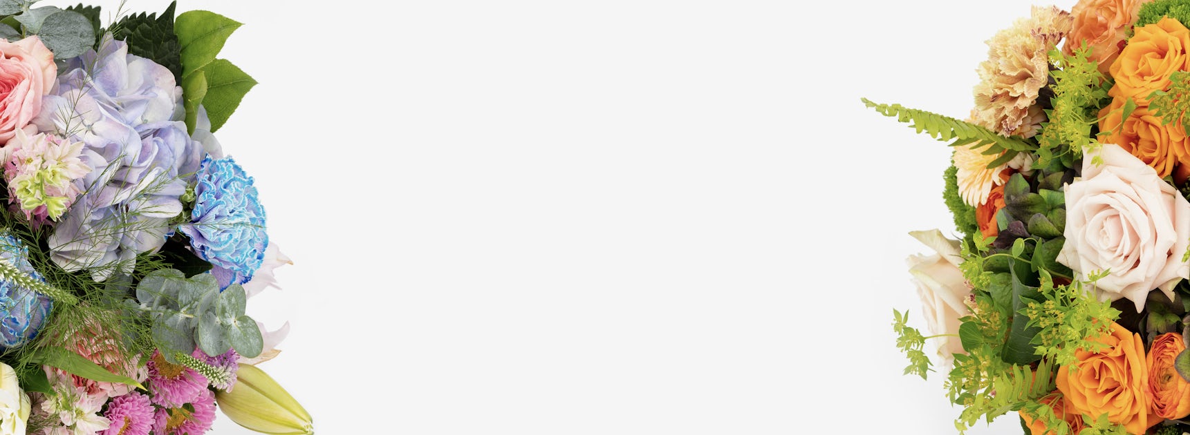 Vibrant floral arrangement featuring pastel roses, hydrangeas, and lush greenery.