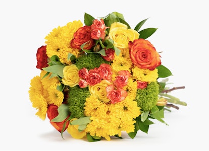Vibrant bouquet of fresh flowers featuring red roses, yellow chrysanthemums, and green foliage on a clean white background, symbolizing a thoughtful gift or celebration.