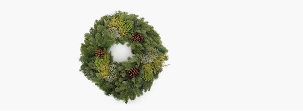 Festive Christmas wreath with lush green pine branches and scattered pine cones on a clean, white background, symbolizing holiday decor and celebrations.
