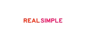 Bright magenta and orange text stating "REAL SIMPLE" centered on a clean white background, evoking a minimalist and straightforward design aesthetic.