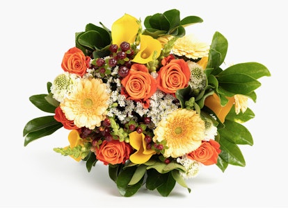 Vibrant bouquet of flowers featuring orange roses, yellow lilies, and white accents with lush greenery on a clean white background.