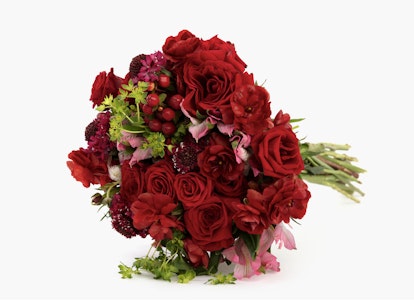 Elegant red floral bouquet featuring lush roses and assorted flowers tied together, presented against a clean white background, perfect for romantic occasions.