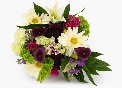 Beautiful bouquet featuring an assortment of flowers including pink roses, white daisies, burgundy calla lilies, and green hydrangeas on a white background.