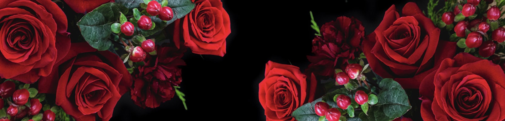 Vibrant red roses and deep burgundy blooms elegantly arranged, perfect for special celebrations.