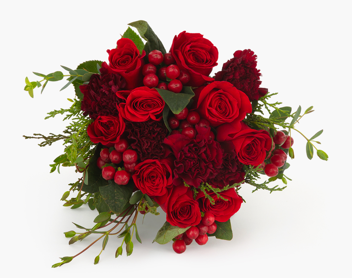 Vibrant bouquet featuring deep red roses, berries, and lush greenery, ideal for celebrations.
