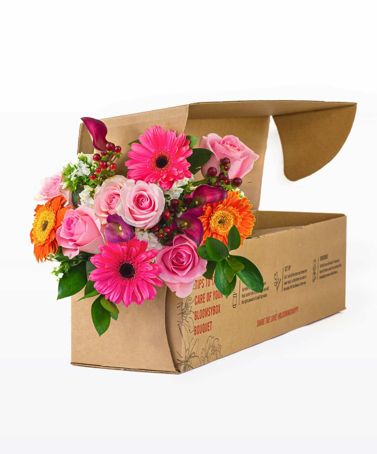 Vibrant floral bouquet featuring pink roses, gerbera daisies, and orange blooms in a stylish box.