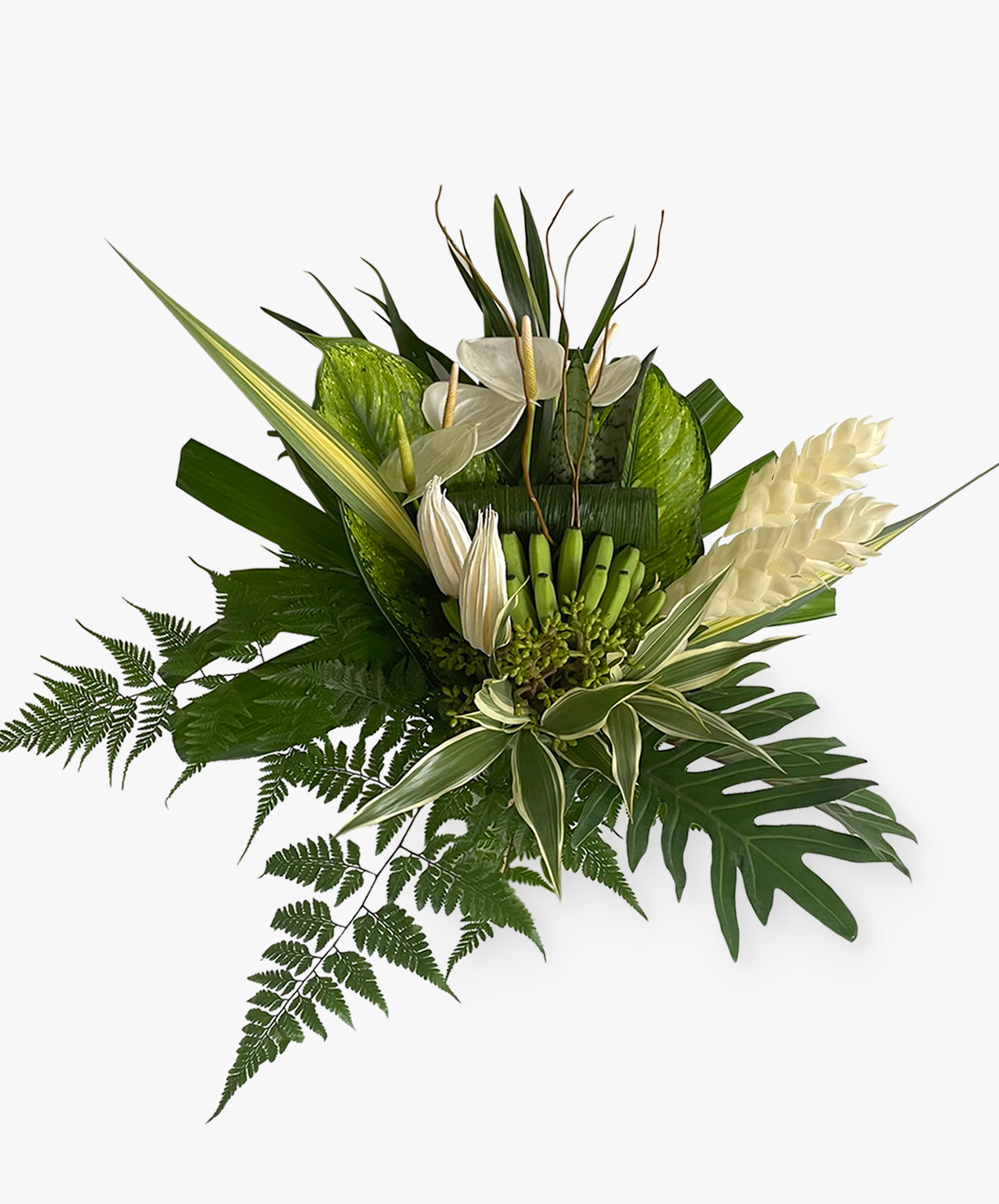 Elegant floral arrangement featuring white anthuriums, lush greenery, and tropical accents.