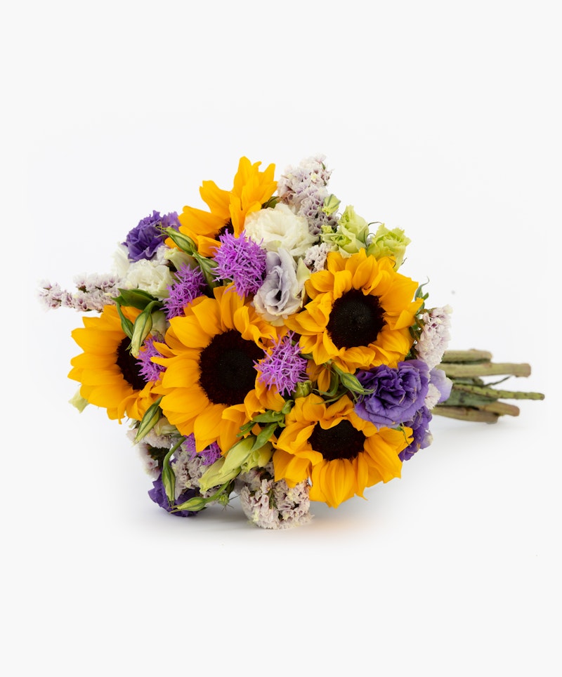 Beautiful bouquet of sunflowers and purple flowers bundled together with green stems visible, set against a clean white background, perfect for special occasions.