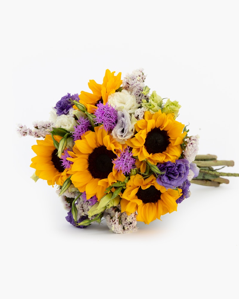 Beautiful bouquet of sunflowers and purple flowers bundled together with green stems visible, set against a clean white background, perfect for special occasions.