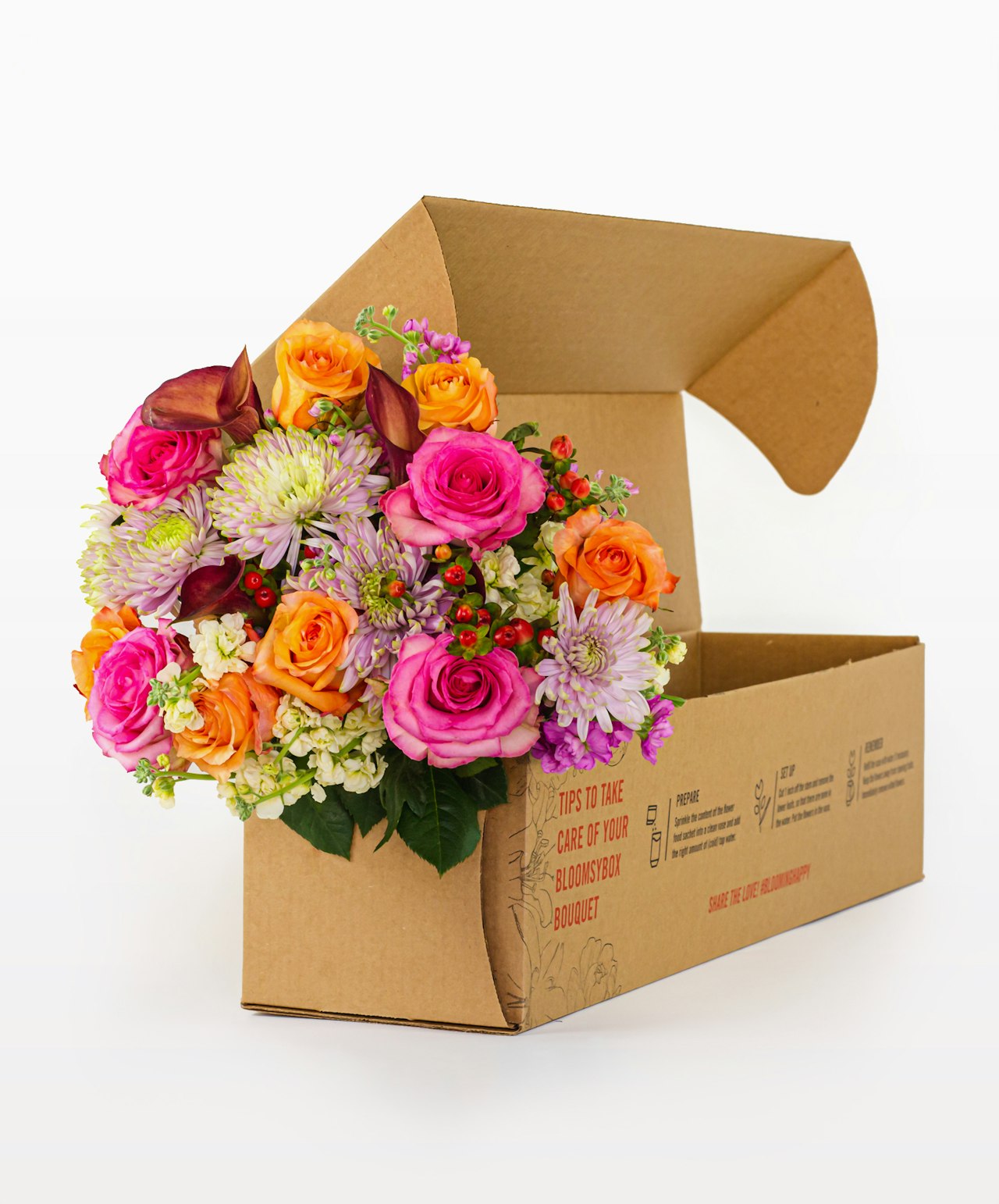 Vibrant flower bouquet with pink and orange roses, beautifully arranged in a floral gift box.
