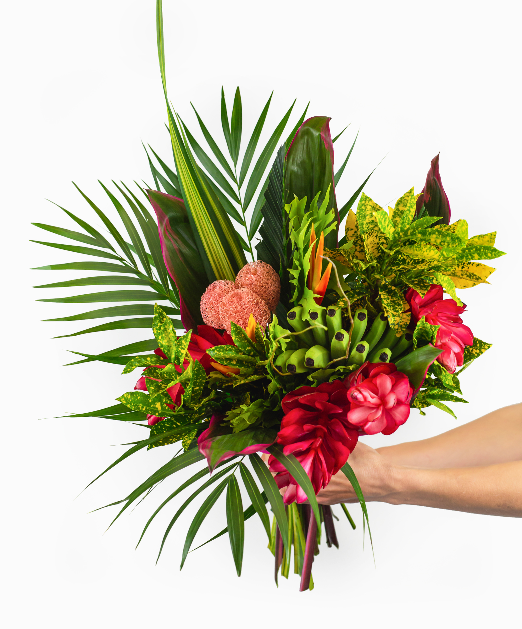 Vibrant tropical bouquet featuring lush greens, red flowers, and unique textures for any occasion.