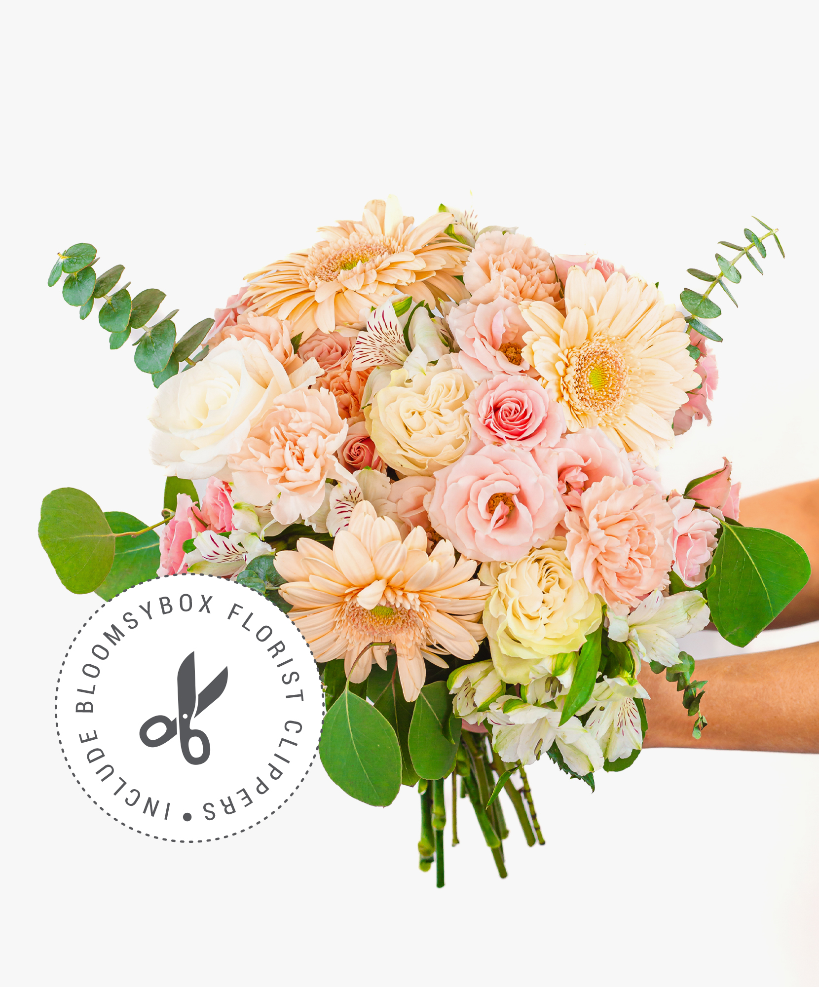 Soft pastel flower bouquet featuring roses, gerbera daisies, and lush greenery.