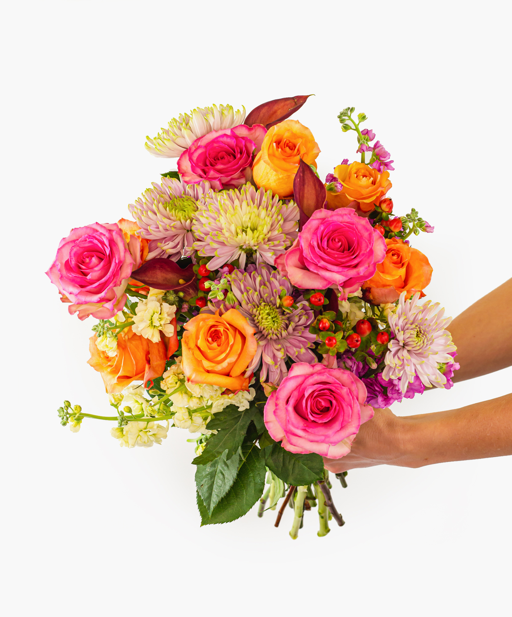 Colorful bouquet featuring pink and orange roses with vibrant seasonal blooms, elegantly held.