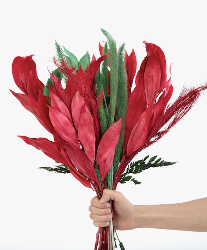 Vibrant bouquet of red foliage with green accents, perfect for striking home decor.