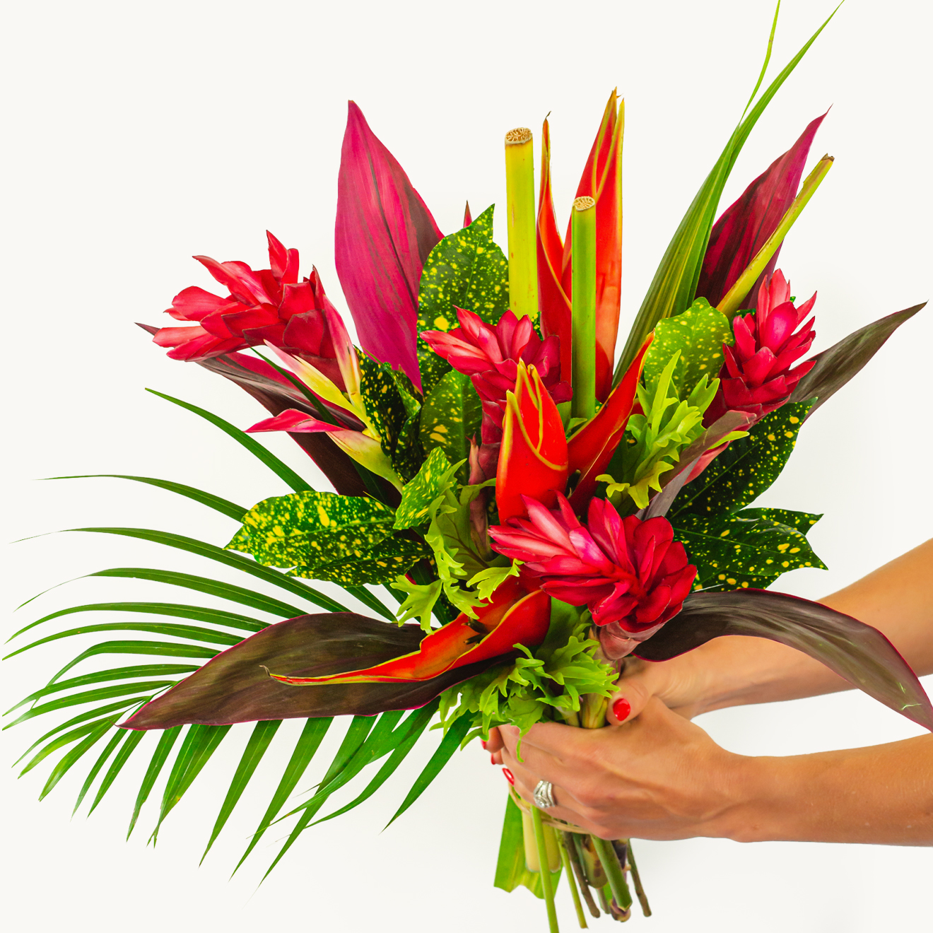 Vibrant tropical bouquet featuring red ginger flowers and lush greenery, ideal for any occasion.