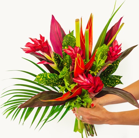 Vibrant tropical bouquet featuring red ginger flowers and lush greenery, ideal for any occasion.