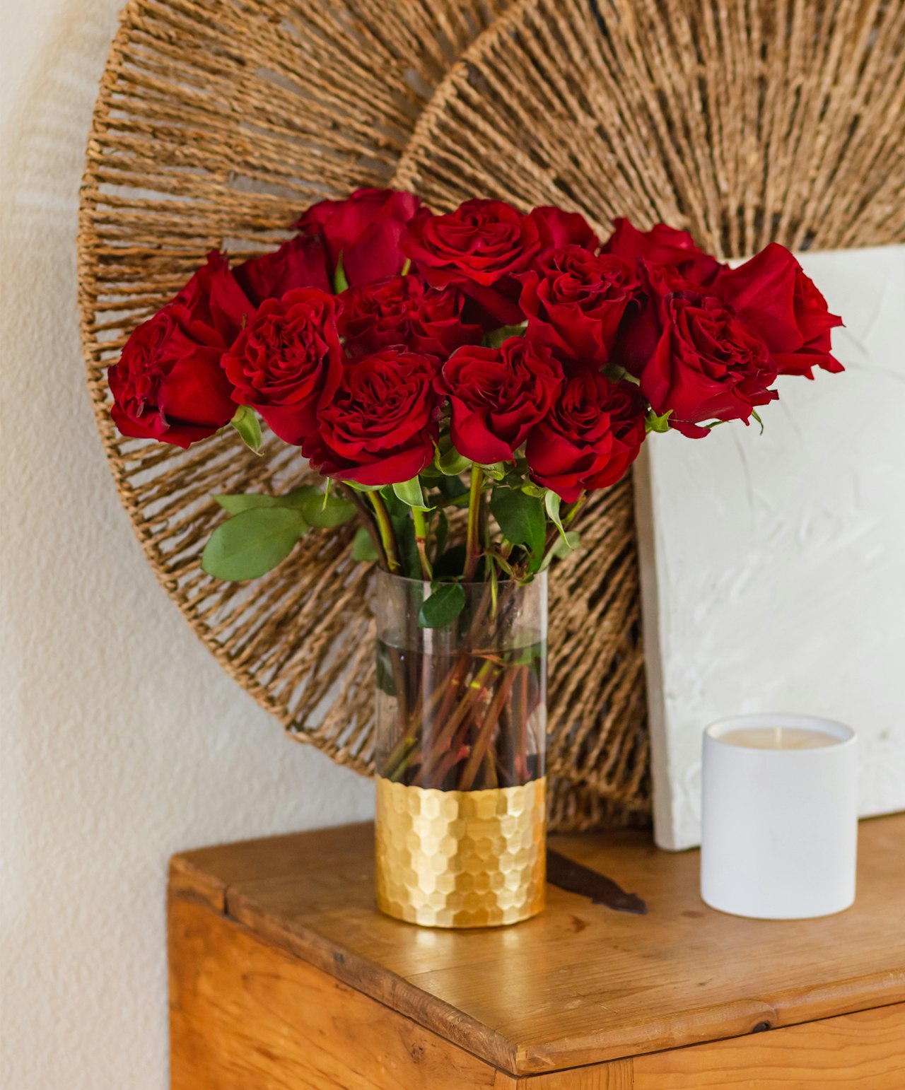 Elegant bouquet of red roses in a stylish glass vase, enhancing home decor.