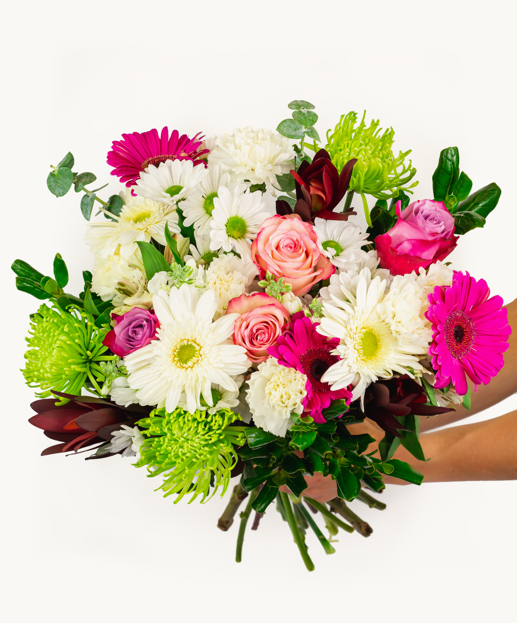 Vibrant bouquet featuring pink roses, white daisies, and green accents, perfect for celebrations.