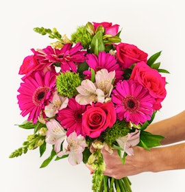 Vibrant bouquet featuring pink roses, gerbera daisies, and alstroemeria, perfect for celebrations.