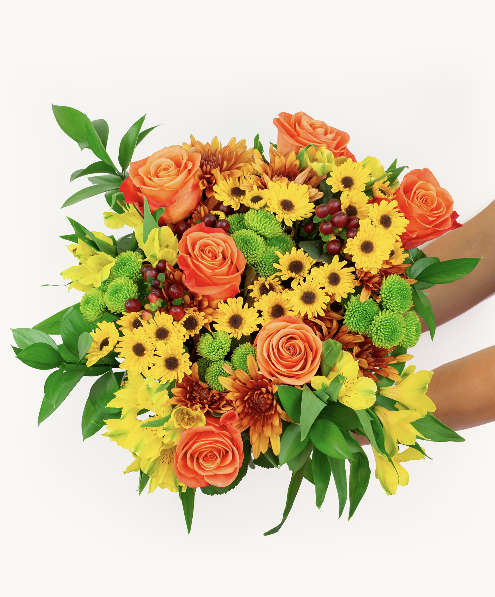 Vibrant floral bouquet featuring orange roses, yellow daisies, and lush greenery.