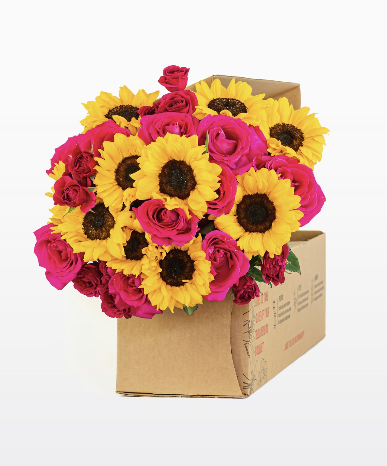 Vibrant floral arrangement with sunflowers and pink roses in a stylish gift box.