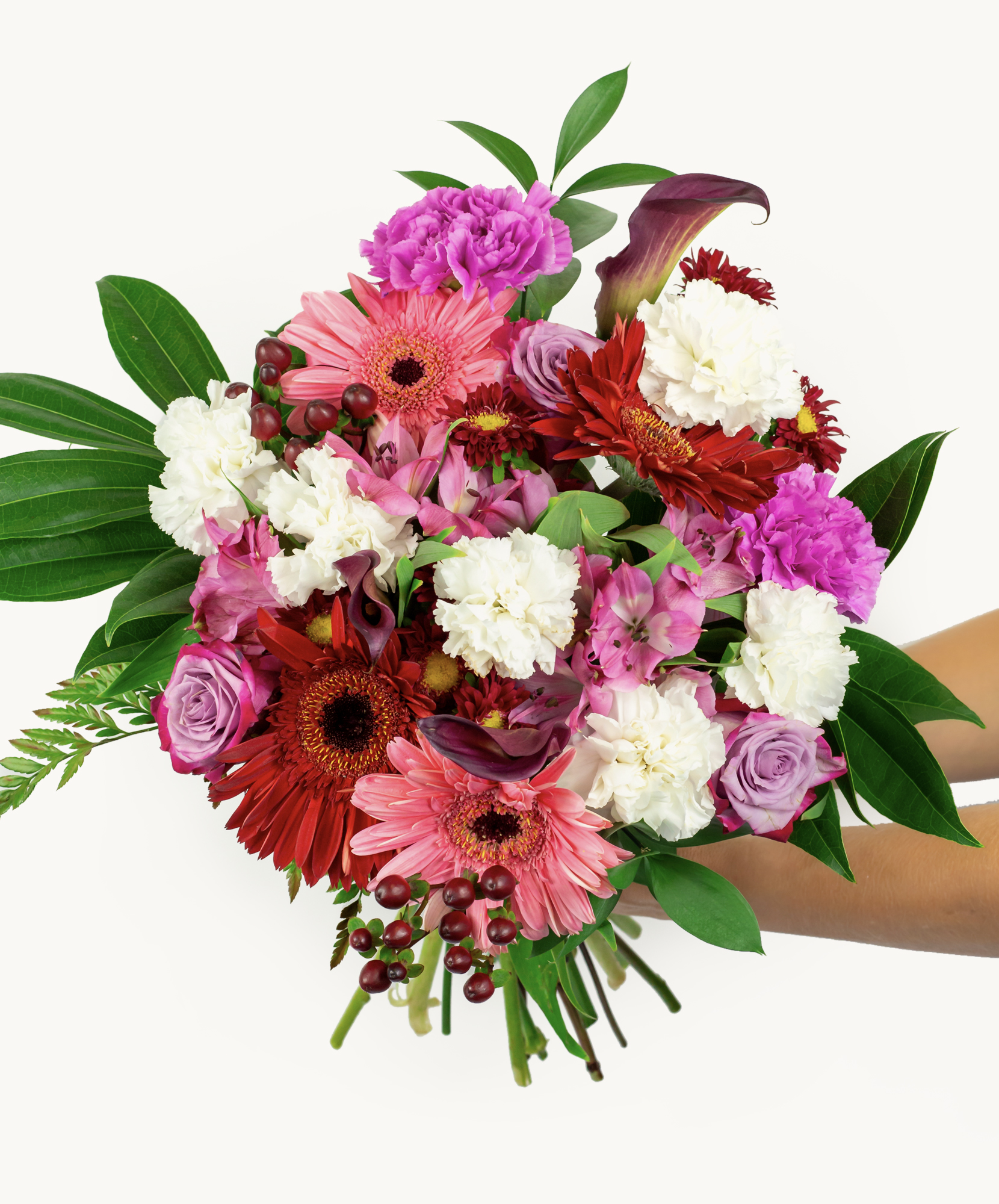 Vibrant floral bouquet featuring pink and purple blooms with lush greenery for any occasion.
